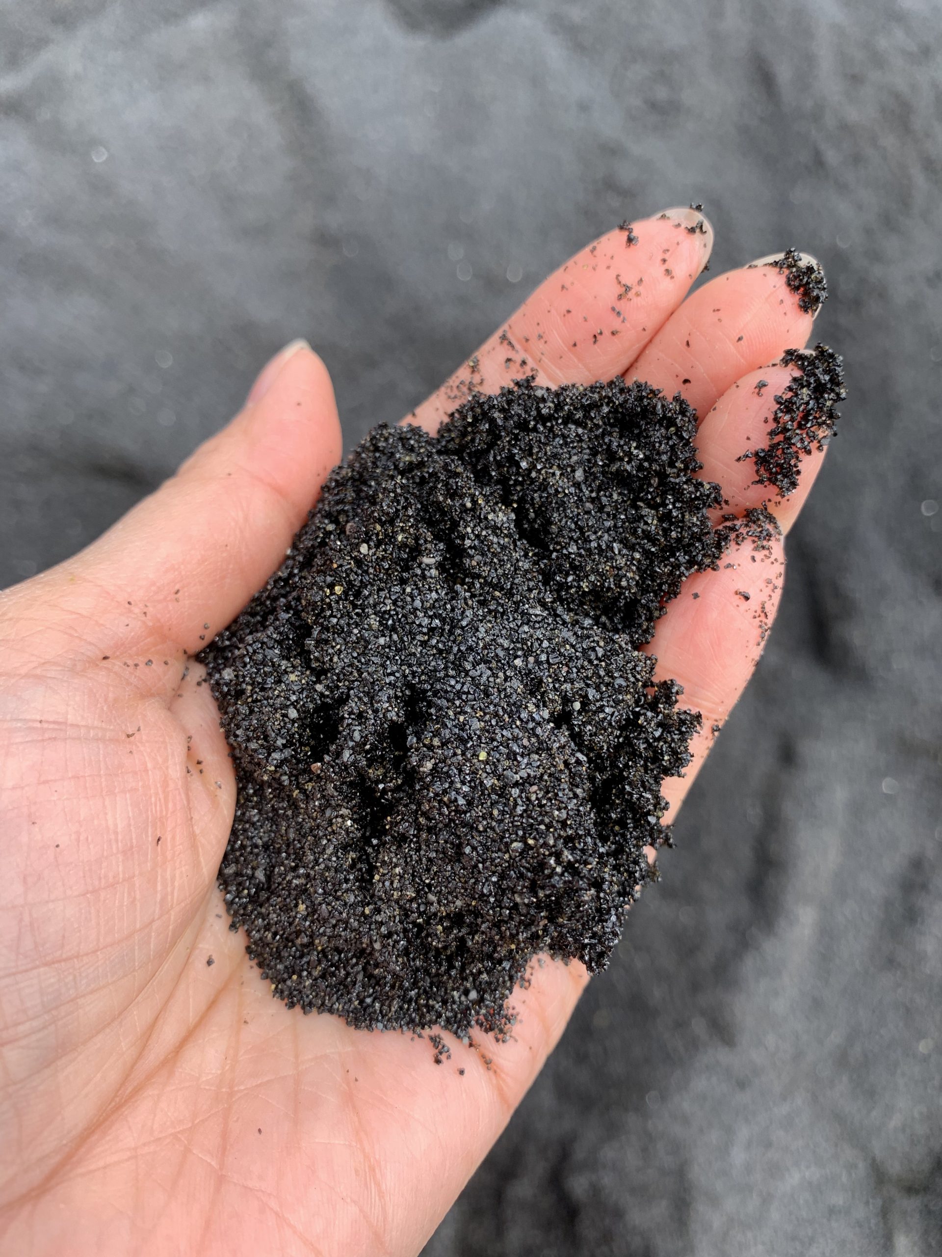 Tiny grains of black sand at Punalu'u Beach