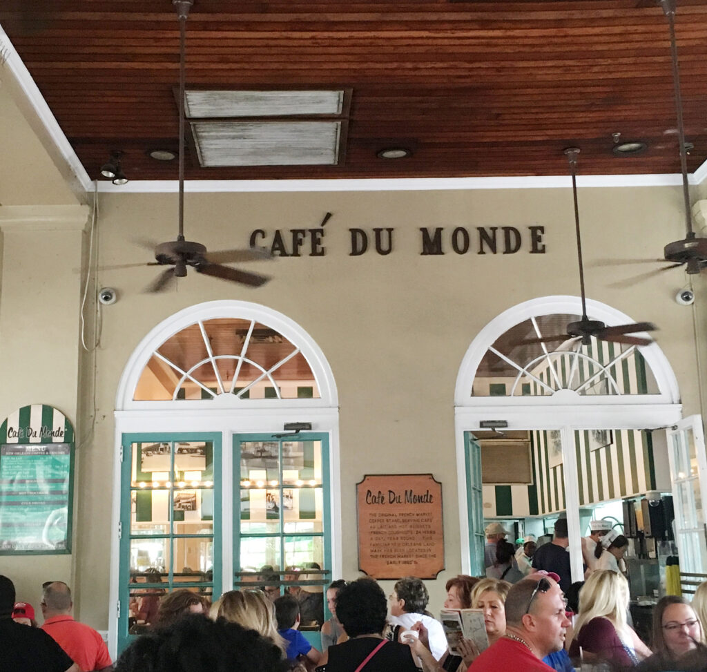 A crowd of tourists dining at the Cafe du Monde in New Orleans.